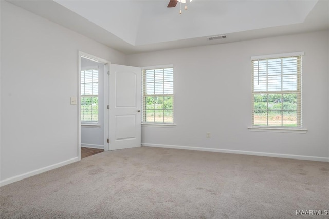 empty room with ceiling fan and carpet floors