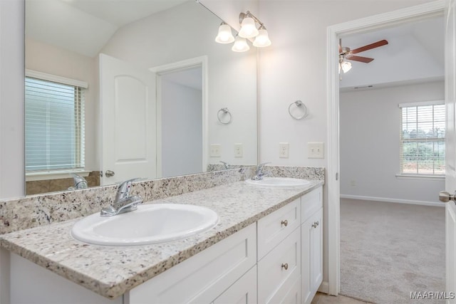 bathroom featuring vanity, lofted ceiling, and ceiling fan