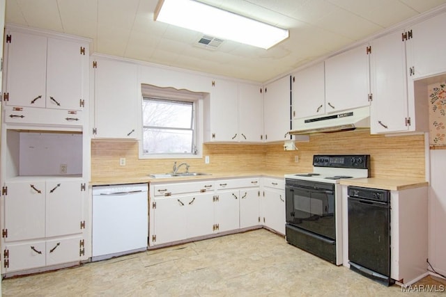 kitchen with electric stove, dishwasher, backsplash, sink, and white cabinetry