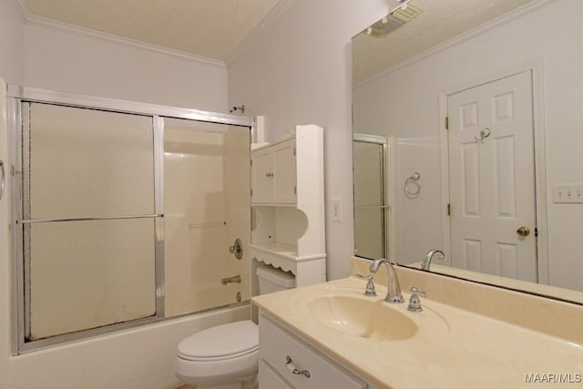 full bathroom featuring toilet, crown molding, vanity, and bath / shower combo with glass door