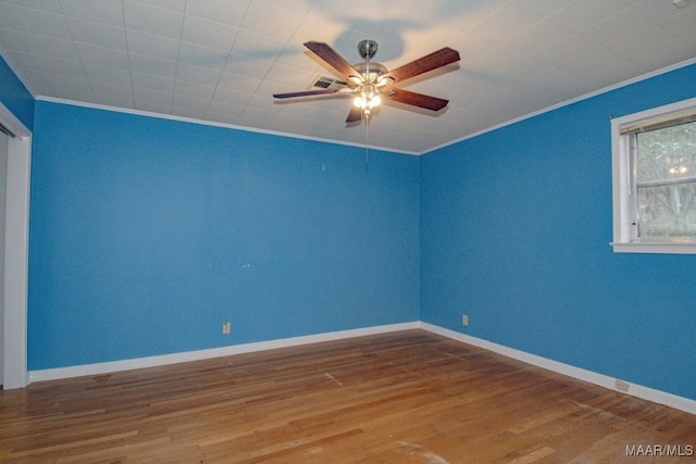 unfurnished room with ceiling fan, ornamental molding, and hardwood / wood-style floors