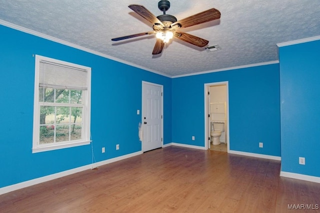 unfurnished room featuring dark hardwood / wood-style flooring, ornamental molding, a textured ceiling, and ceiling fan