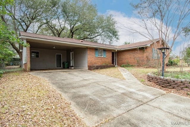 ranch-style house featuring a carport