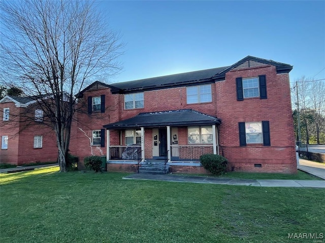 view of front of property with covered porch and a front yard