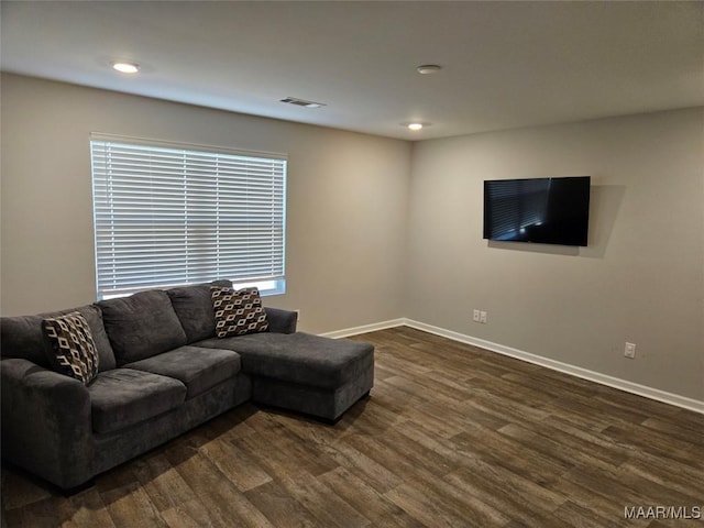 living room with dark hardwood / wood-style flooring