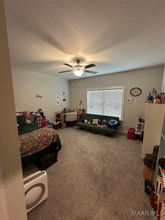 carpeted bedroom featuring ceiling fan