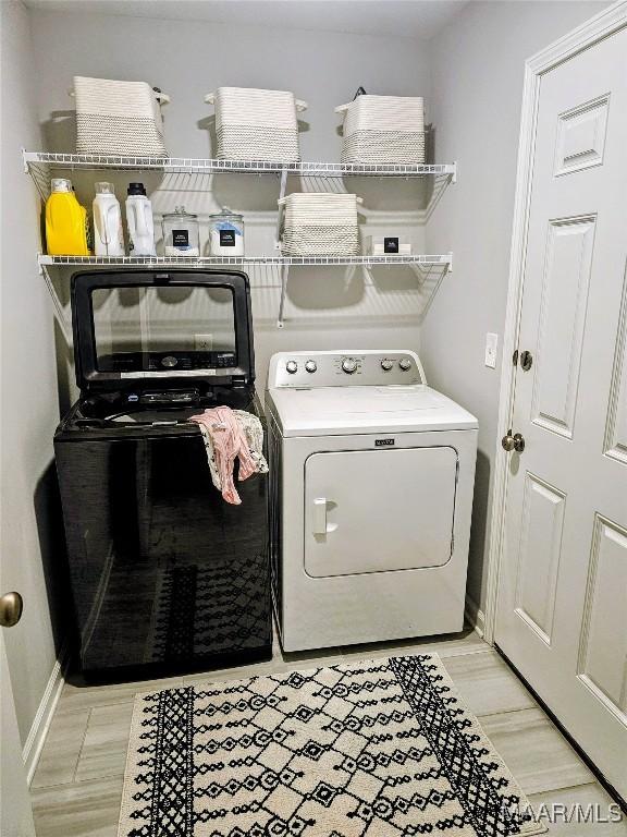 laundry room featuring separate washer and dryer