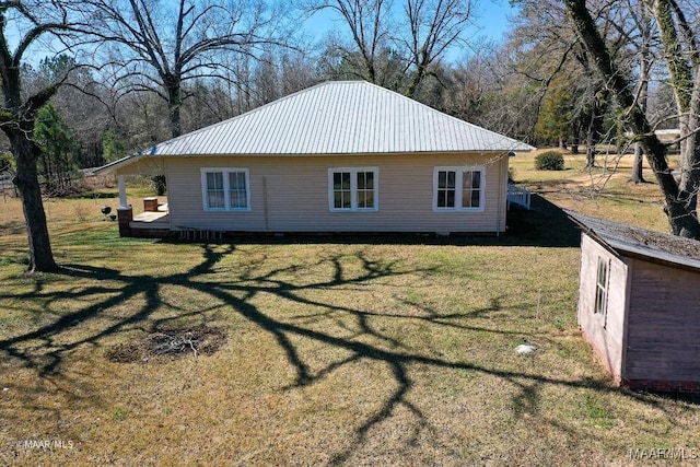 view of home's exterior with a yard