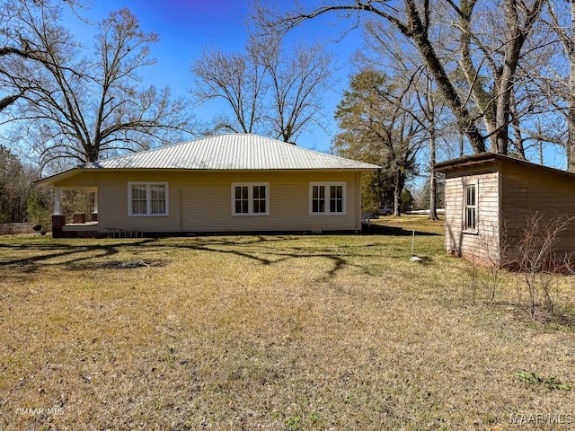 back of property with a yard