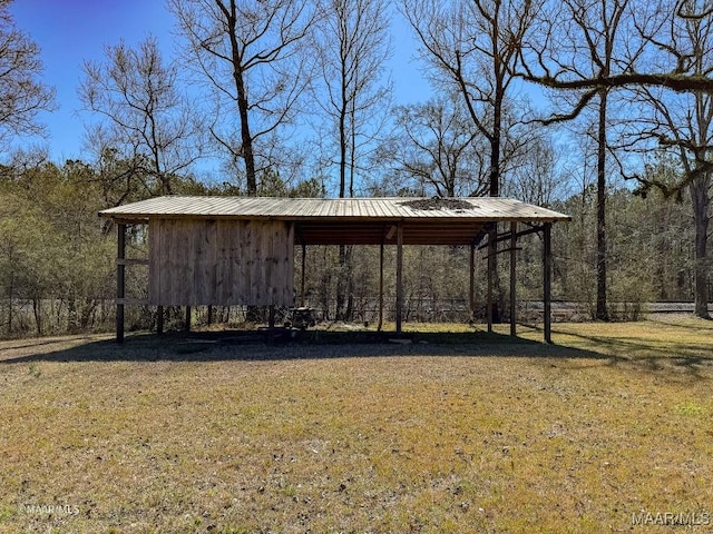 view of outbuilding featuring a lawn