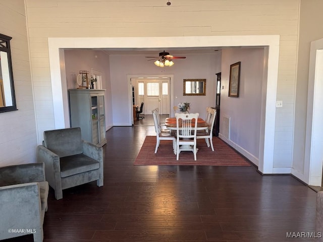 dining room featuring dark hardwood / wood-style flooring and ceiling fan