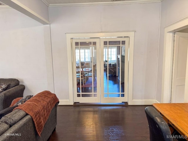 entryway with crown molding and dark hardwood / wood-style flooring