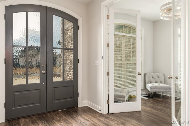 entryway with french doors and dark hardwood / wood-style floors