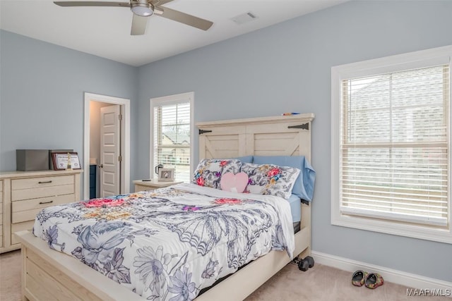 bedroom with light colored carpet and ceiling fan