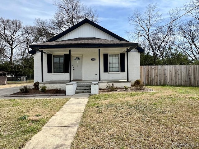 bungalow featuring a front yard and a porch