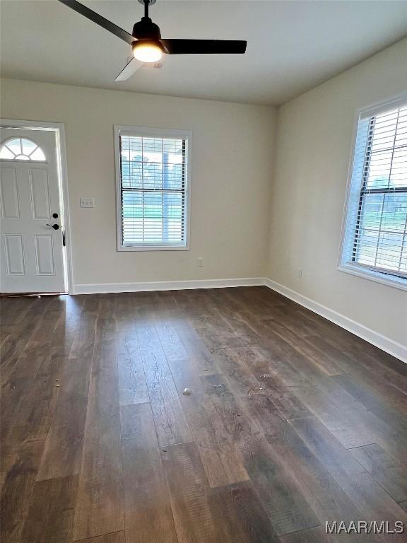 foyer with dark hardwood / wood-style floors and ceiling fan