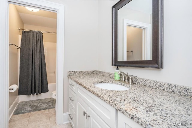 full bathroom with vanity, tile patterned flooring, toilet, and shower / bath combo with shower curtain