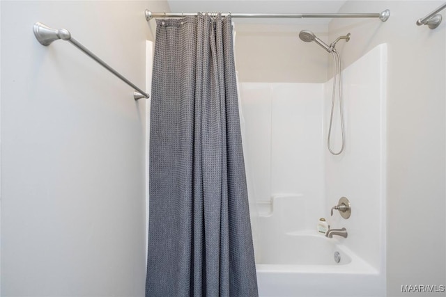 bathroom featuring shower / bath combination with curtain