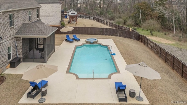 view of swimming pool with an in ground hot tub and a patio