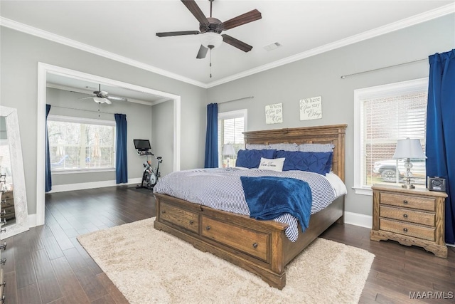 bedroom with ceiling fan, ornamental molding, and dark hardwood / wood-style floors