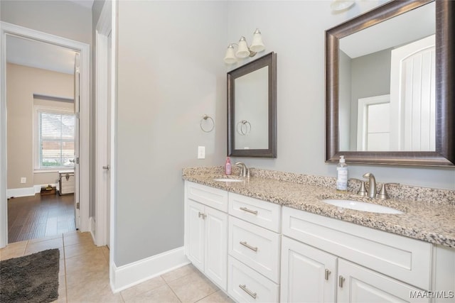 bathroom with tile patterned floors and vanity