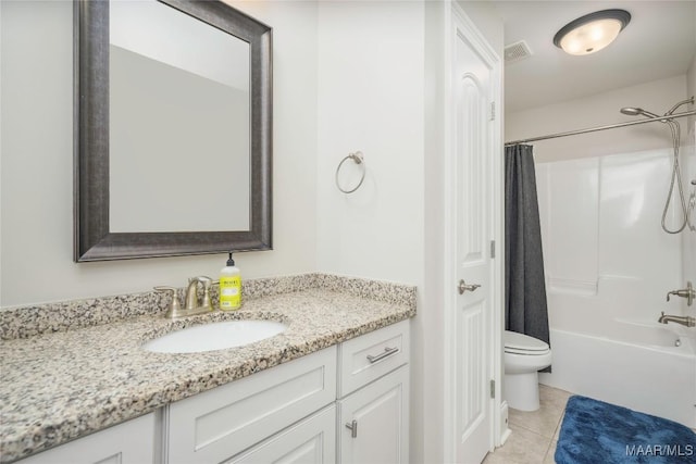 full bathroom featuring tile patterned floors, vanity, toilet, and shower / tub combo