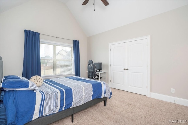 carpeted bedroom featuring high vaulted ceiling, a closet, and ceiling fan