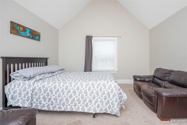 carpeted bedroom featuring high vaulted ceiling