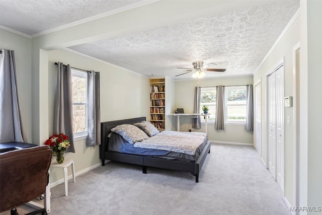 bedroom featuring multiple windows, crown molding, and light colored carpet