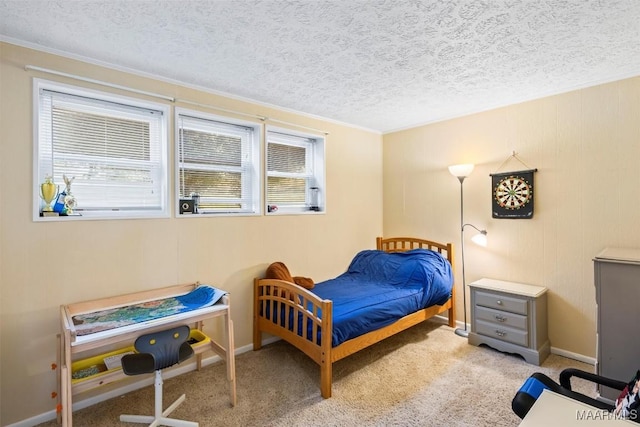 bedroom featuring light carpet and a textured ceiling