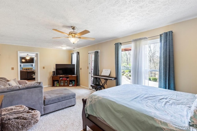 carpeted bedroom with ceiling fan and a textured ceiling