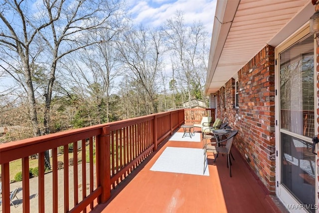 wooden balcony featuring a deck