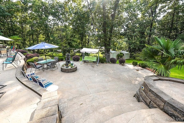 view of patio / terrace featuring a shed