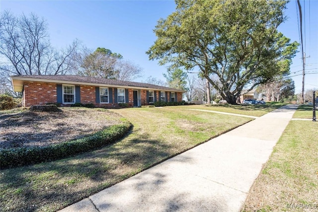 ranch-style house with a front lawn