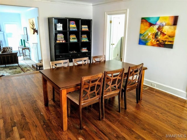 dining space featuring dark wood-type flooring