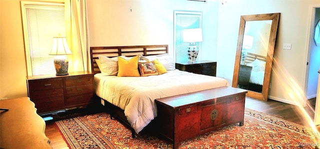 bedroom with wood-type flooring