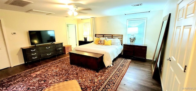 bedroom featuring dark wood-type flooring and ceiling fan