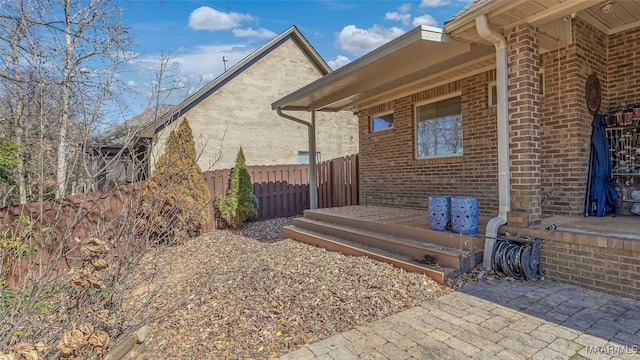 view of side of property featuring a patio