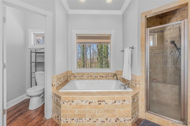 bathroom with ornamental molding, toilet, hardwood / wood-style floors, and independent shower and bath