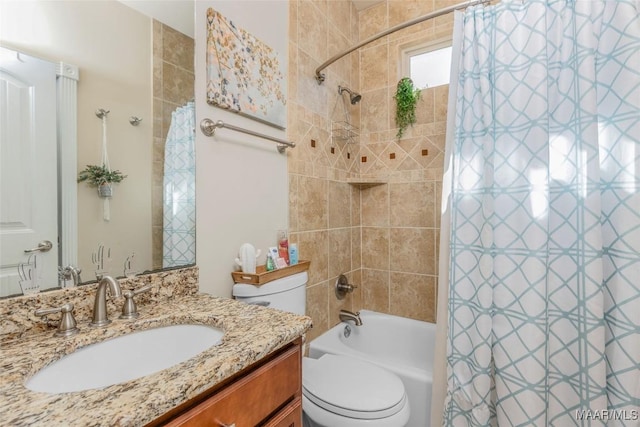 full bathroom with vanity, toilet, and shower / bath combo with shower curtain