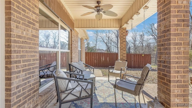 view of patio featuring ceiling fan