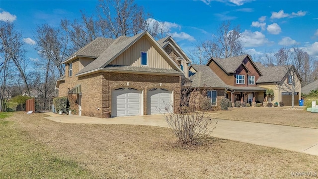 view of front of property featuring a front lawn and a garage