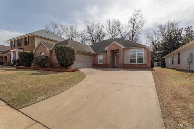 view of front of home featuring central AC, a front lawn, and a garage