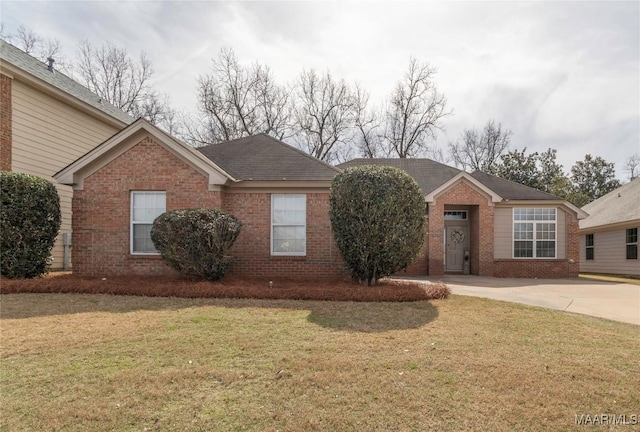 ranch-style home featuring a front yard