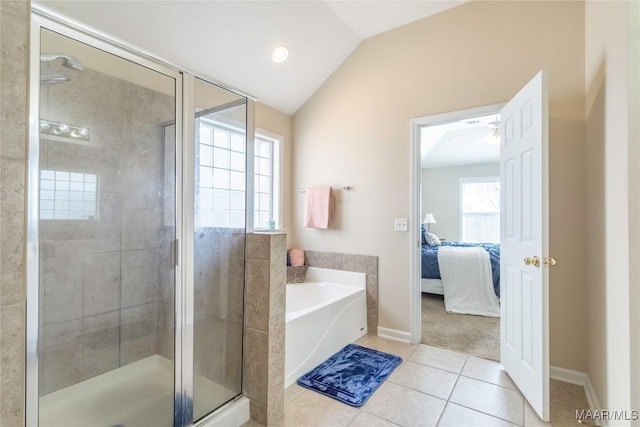 bathroom with tile patterned floors, lofted ceiling, and independent shower and bath