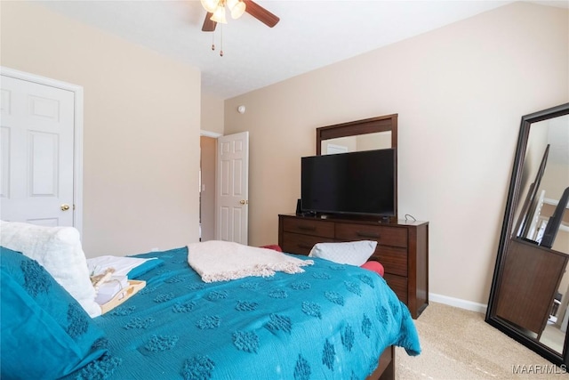 bedroom featuring ceiling fan and light colored carpet