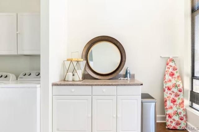 laundry area with cabinets and washer and clothes dryer
