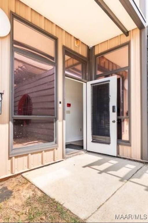 doorway to property featuring a patio
