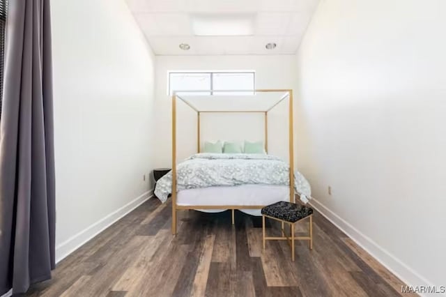 bedroom featuring dark hardwood / wood-style flooring
