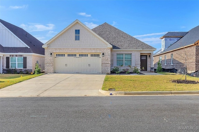 view of front of house featuring a front yard and a garage